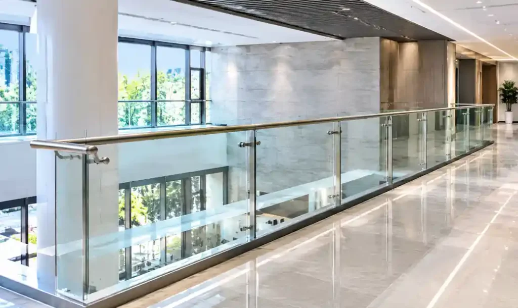 Commercial glass handrail installation in modern architectural project