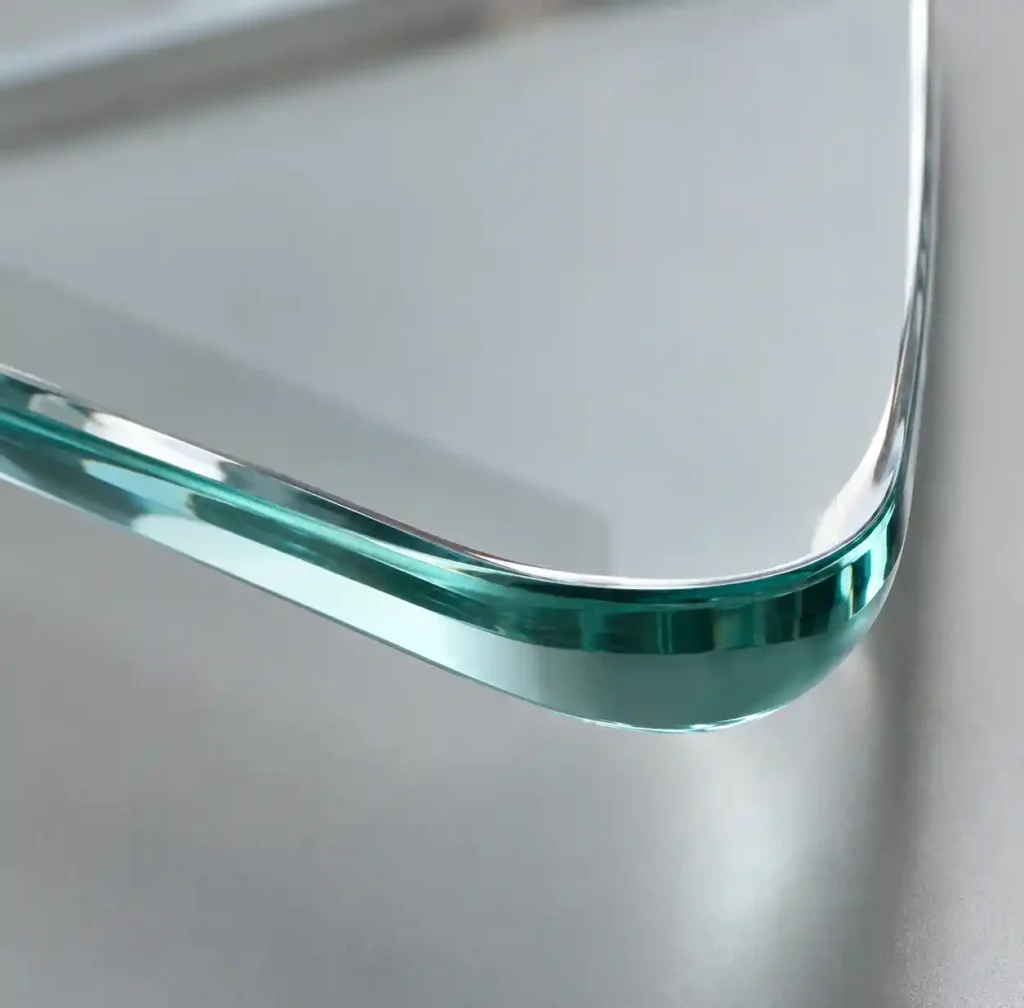 Close-up of curved glass edge showing precision edge grinding and quality
